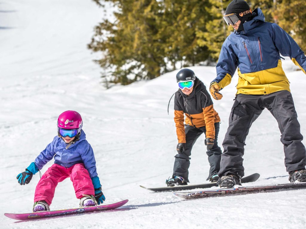 Family snowboarding at Red Mountain