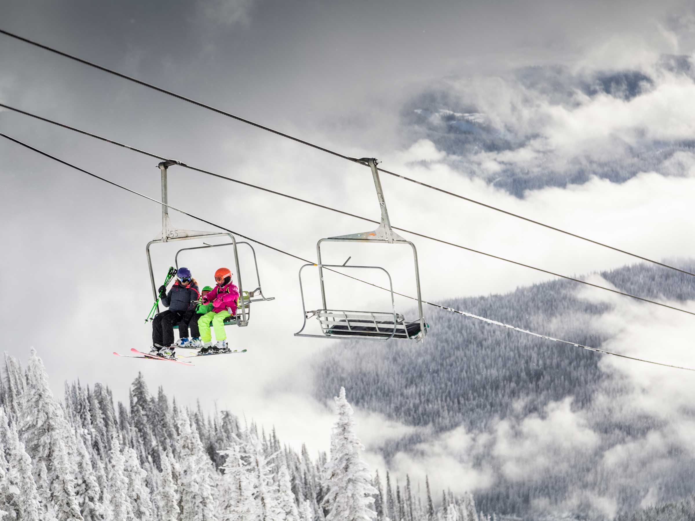 Family on chairlift at Red Mountain, BC