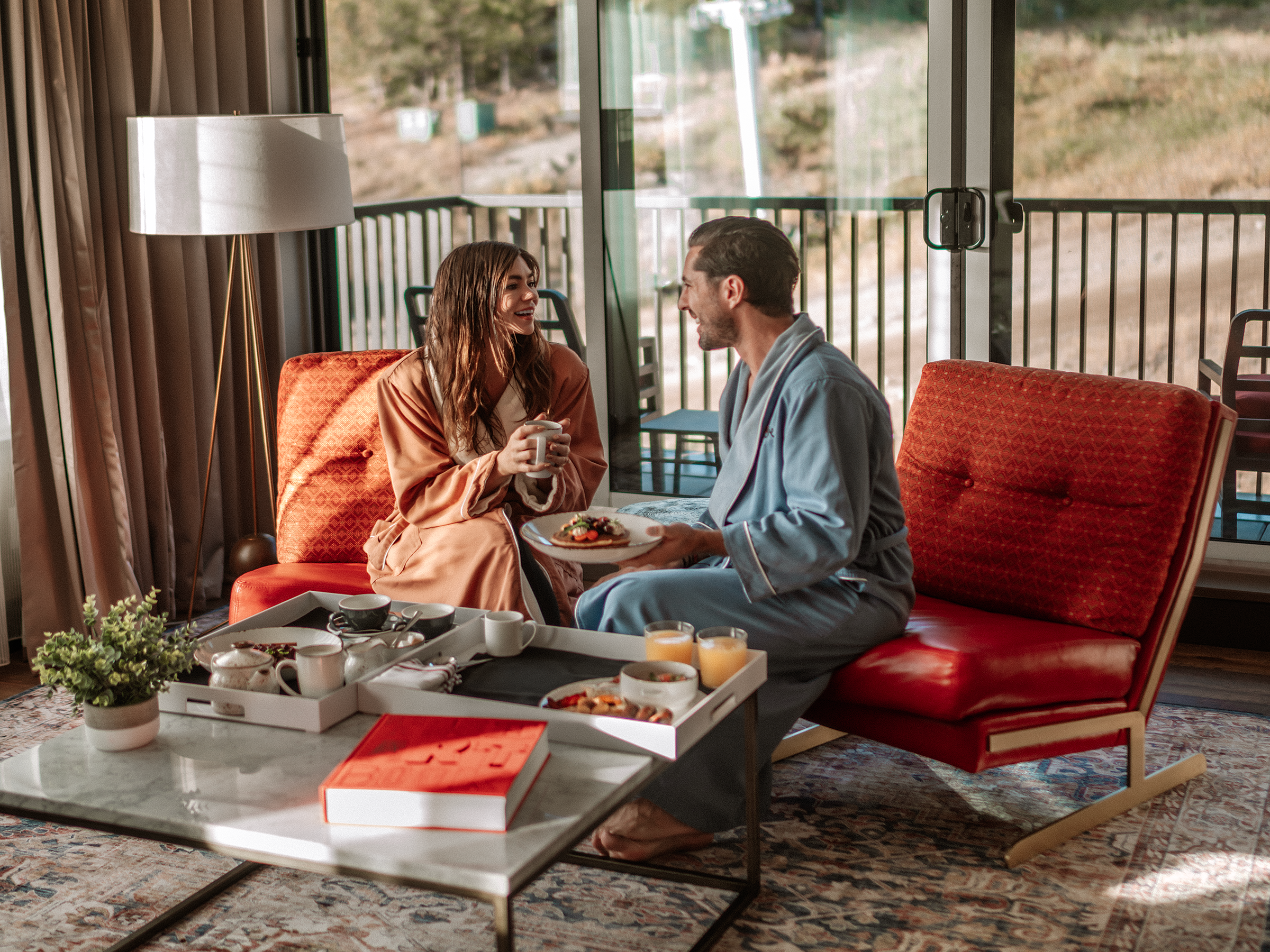 Couple enjoying breakfast in room at The Josie